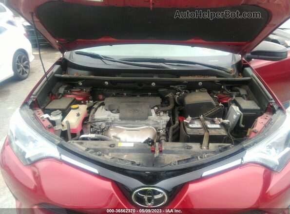 2T3ZFREV9JW494077 2018 TOYOTA LE Maroon Rear view