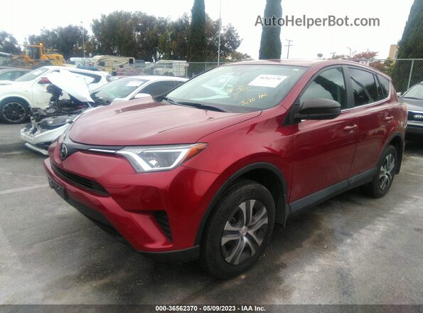 2T3ZFREV9JW494077 2018 TOYOTA LE Maroon Front left