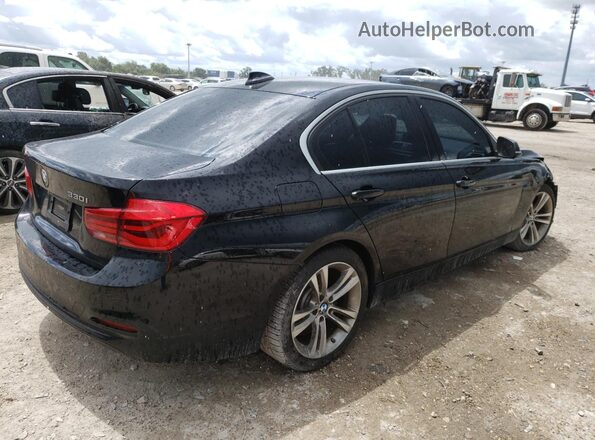WBA8B9C51JEE80966 2018 BMW 7 SERIES Black Rear view