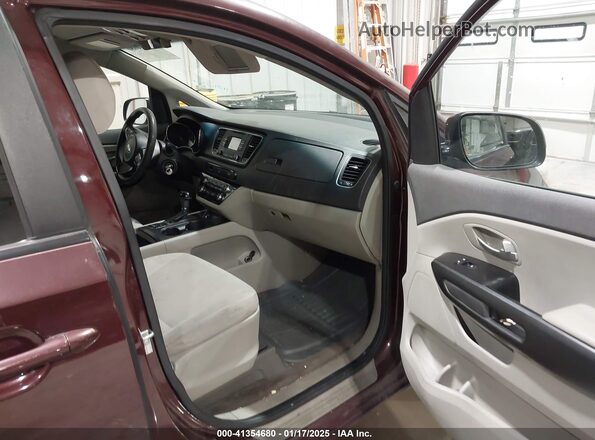 KNDMB5C10G6121308 2016 KIA SEDONA Burgundy Вид салону спереду