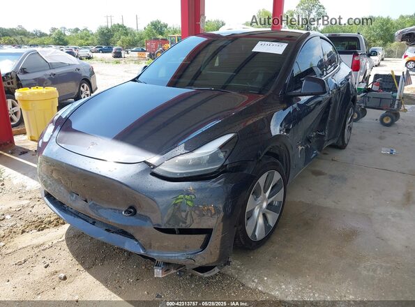 7SAYGDED6RF054342 2024 TESLA MODEL Y Gray Առջևի ձախ երեք քառորդ տեսարան