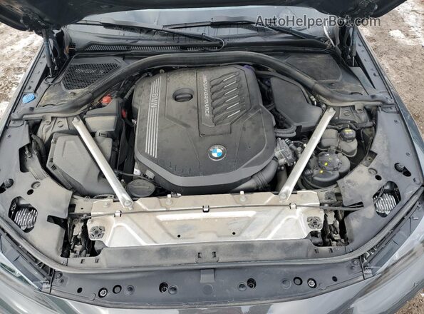 WBA13AR04NCJ02389 2022 BMW M4 Gray Vista interior trasera