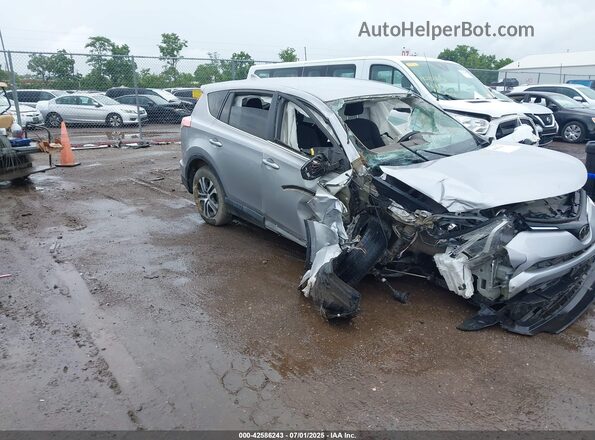 2T3BFREV3JW709681 2018 TOYOTA LE Silver 