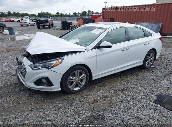 5NPE34AF9KH752647 2019 HYUNDAI SONATA White წინა მარცხენა ხედი სამი მეოთხედიდან