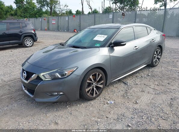 1N4AA6APXJC405644 2018 NISSAN MAXIMA Серебряный Передняя левая четверть