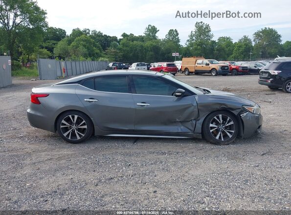 1N4AA6APXJC405644 2018 NISSAN MAXIMA Серебряный Вид задней части салона