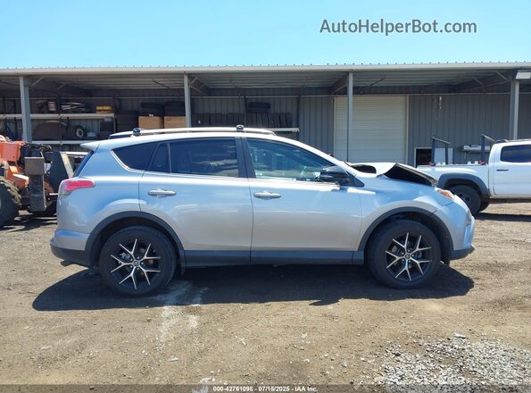 2T3JFREV8GW415732 2016 TOYOTA RAV4 Silver Vista interior trasera