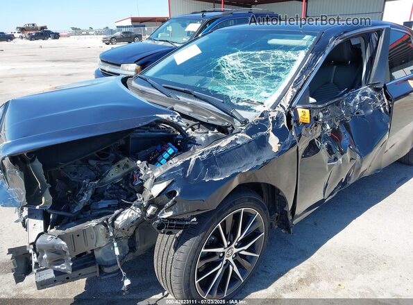 4T1G11AKXMU419422 2021 TOYOTA CAMRY Black Вид спереду