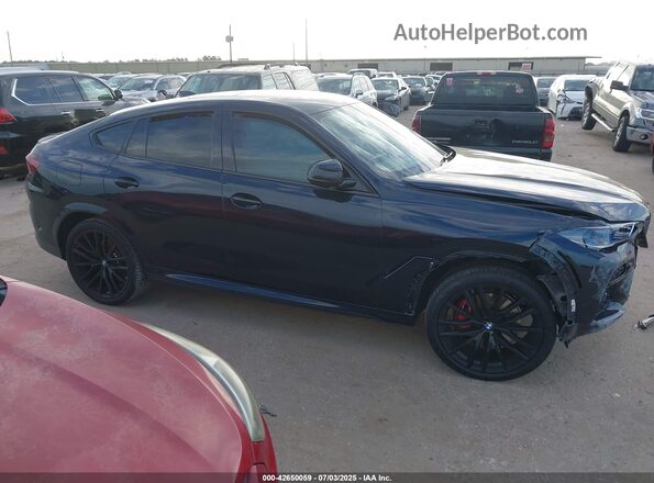 5UXCY6C01P9N44225 2023 BMW X6 Black Widok wnętrza z tyłu