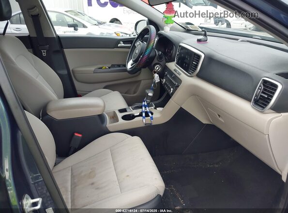 KNDPMCAC1M7899087 2021 KIA SPORTAGE Gray Vista interior delantera