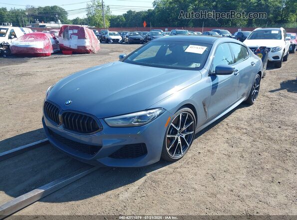 WBAGV8C02NCH89994 2022 BMW M8 Синий Вид спереди