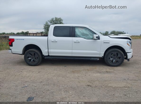 1FT6W1EV6PWG04601 2023 FORD F-150 LIGHTNING White Vista interior trasera