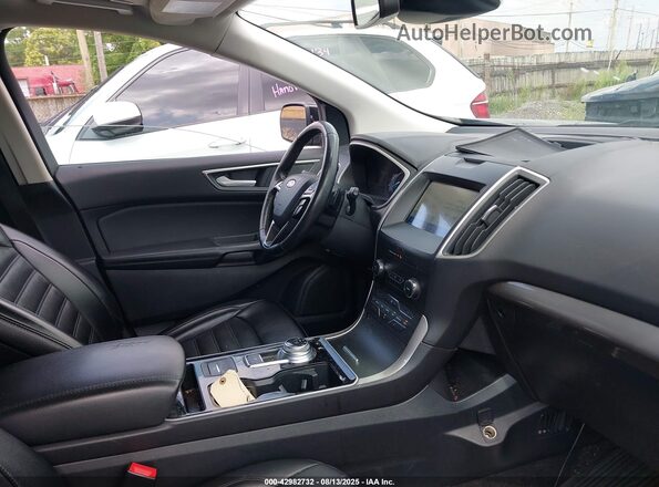 2FMPK4J95LBB49502 2020 FORD EDGE Черный Вид салона спереди