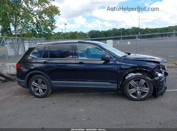 3VV2B7AXXLM152054 2020 VOLKSWAGEN TIGUAN Black Widok wnętrza z tyłu