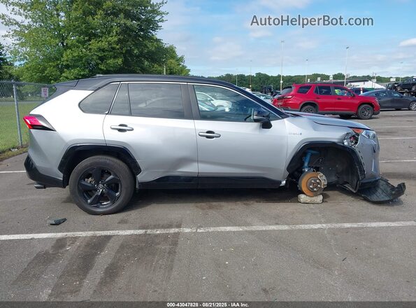 4T3E6RFV4MU037274 2021 TOYOTA RAV4 HYBRID Silver Widok wnętrza z tyłu