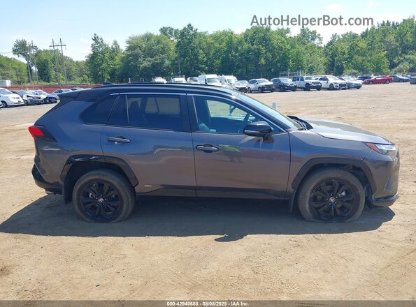 4T3E6RFV7PU136515 2023 TOYOTA RAV4 HYBRID Gray Vista interior trasera