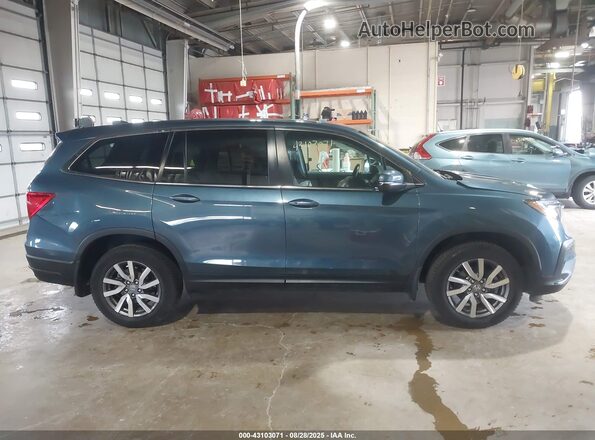 5FNYF6H57MB097886 2021 HONDA PILOT Blue Սալոնի հետևի տեսք