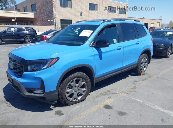 5FNYF8H64SB018935 2025 HONDA PASSPORT Light Blue Vista tres cuartos delantera izquierda
