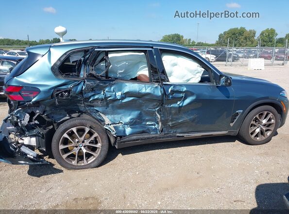 5UX23EU00R9V78243 2024 BMW X5 Teal Vista interior trasera