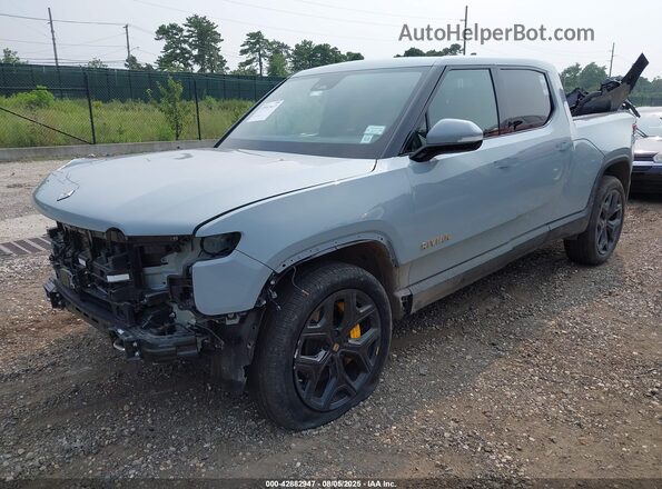 7FCTGAAA4PN023777 2023 RIVIAN R1T Light Blue Vista tres cuartos delantera izquierda