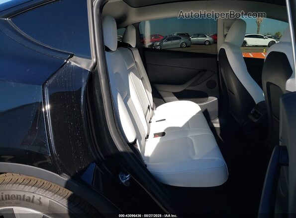 7SAYGDED0RF014743 2024 TESLA MODEL Y Black Vista de la etiqueta del VIN
