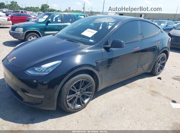 7SAYGDEEXPA087718 2023 TESLA MODEL Y Black წინა მარცხენა ხედი სამი მეოთხედიდან