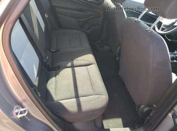 KL77LFE22RC027227 2024 CHEVROLET TRAX Серый Вид задней части салона