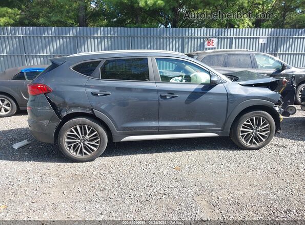 KM8J3CAL3MU380600 2021 HYUNDAI TUCSON Gray Rear interior view