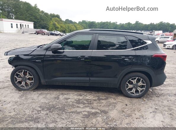 KNDERCAA3M7121378 2021 KIA SELTOS Black Vista interior trasera