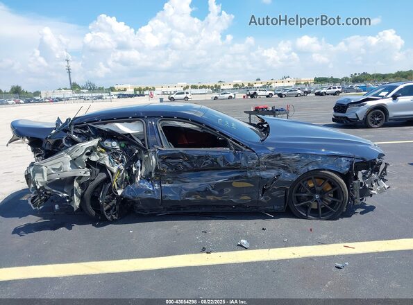 WBAGV2C03NCJ85591 2022 BMW 8 SERIES Черный Вид задней части салона