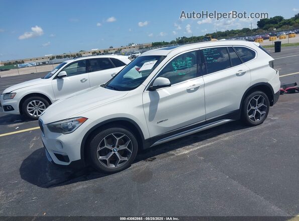 WBXHU7C36J5H44587 2018 BMW X1 White Front left