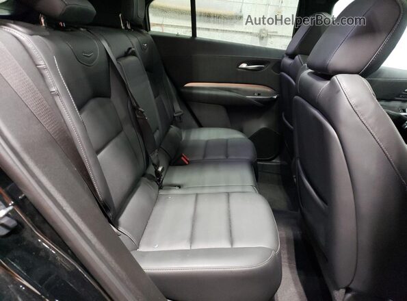 1GYFZDR40PF172303 2023 CADILLAC XT4 Черный Вид задней части салона
