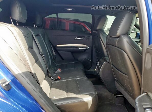 1GYFZDR45PF108385 2023 CADILLAC XT4 Blue Rear interior view