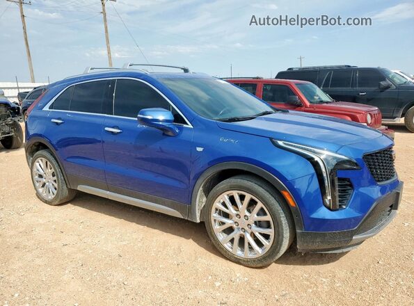 1GYFZDR45PF108385 2023 CADILLAC XT4 Blue Front right
