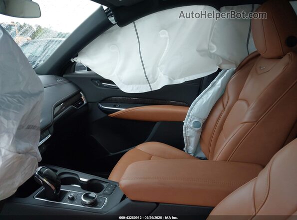 1GYFZDR4XPF124940 2023 CADILLAC XT4 Beige Вид салону спереду