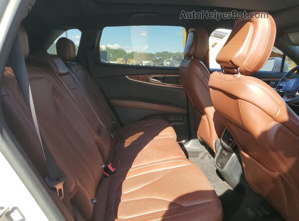 2LMPJ8K98LBL20014 2020 LINCOLN NAUTILUS Cream Vista interior trasera