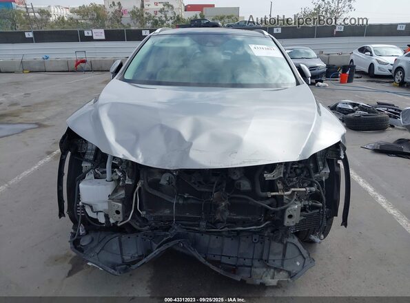 2T2JGMDA8NC077394 2022 LEXUS RX 450H Silver Widok wnętrza z tyłu