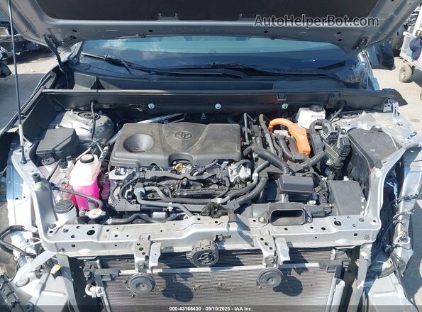 2T3T6RFV1NW030601 2022 TOYOTA RAV4 HYBRID Silver Widok z tyłu