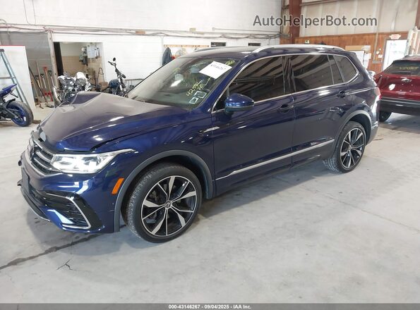 3VV4B7AX6NM100884 2022 VOLKSWAGEN TIGUAN Blue Vista tres cuartos delantera izquierda