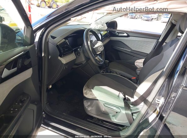 3VVCX7B2XPM313520 2023 VOLKSWAGEN TAOS Black Front interior view