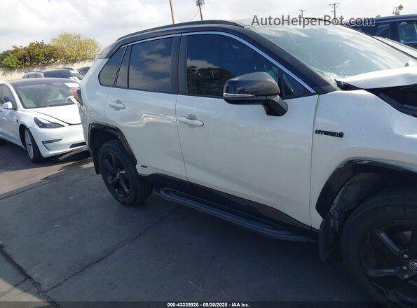 4T3E6RFVXMU027297 2021 TOYOTA RAV4 HYBRID Белый Вид задней части салона