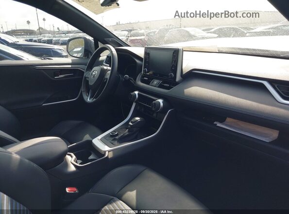 4T3E6RFVXMU027297 2021 TOYOTA RAV4 HYBRID Белый Вид салона спереди