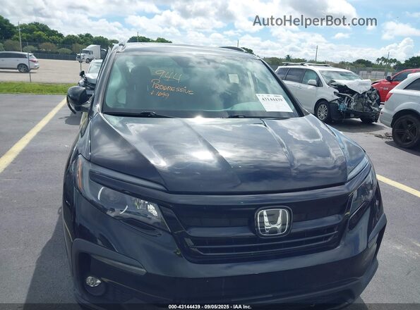 5FNYF5H25NB011699 2022 HONDA PILOT Черный Вид задней части салона