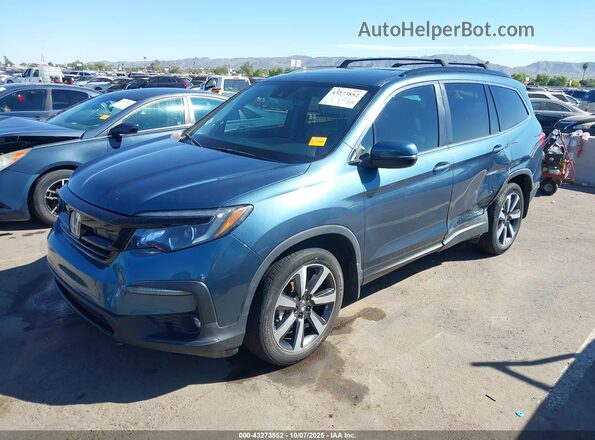 5FNYF6H27NB028574 2022 HONDA PILOT Navy Vista tres cuartos delantera izquierda