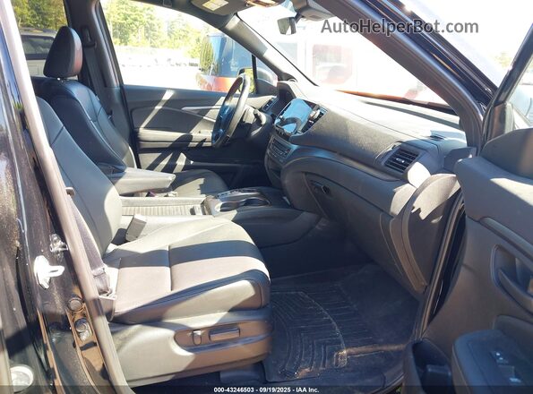 5FNYF8H54PB013071 2023 HONDA PASSPORT Black Widok wnętrza z przodu