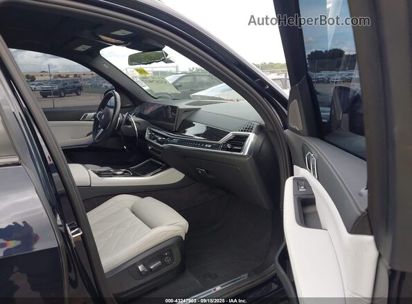 5UX23EU04R9V06803 2024 BMW X5 Dark Blue Front interior view
