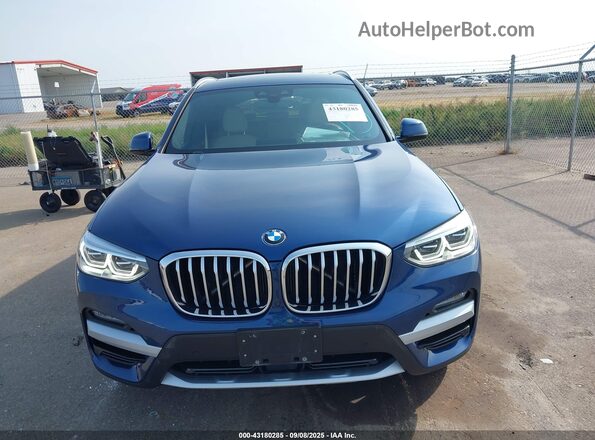 5UXTY5C04LLT39019 2020 BMW X3 Blue Vista interior trasera