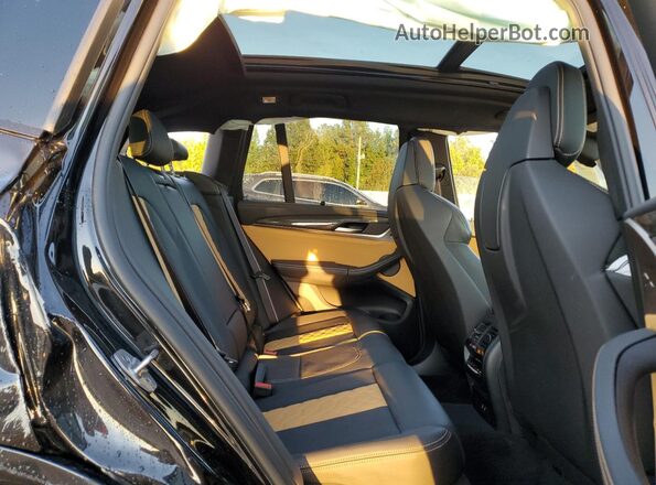 5YMTS0C04M9G46933 2021 BMW X3 Black Rear interior view