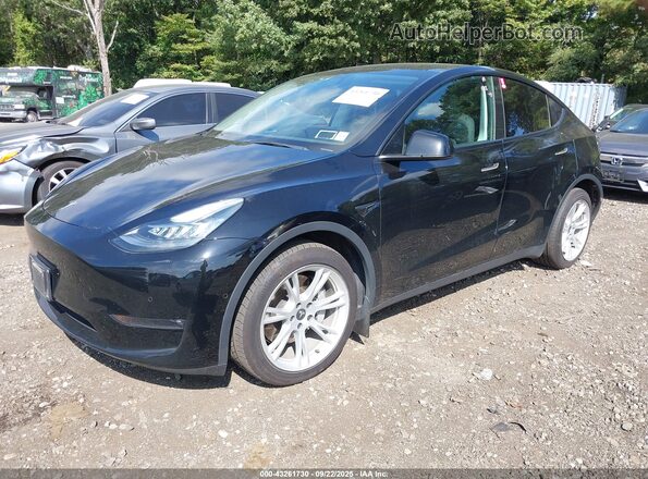 7SAYGAEE5NF385091 2022 TESLA MODEL Y Black წინა მარცხენა ხედი სამი მეოთხედიდან