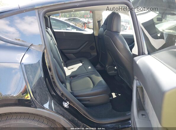 7SAYGAEE5NF385091 2022 TESLA MODEL Y Black VIN კოდის სტიკერის ხედი